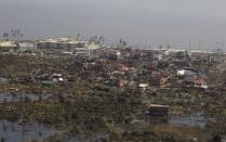 An aerial view shows damages caused by Typhoon Haiyan in the province of Leyte, central Philippines November 10, 2013. One of the most powerful storms ever recorded killed at least 10,000 people in the central Philippines, a senior police official said on Sunday, with huge waves sweeping away coastal villages and devastating one of the main cities in the region. REUTERS/Ryan Lim/Malacanang Photo Bureau/Handout via Reuters (PHILIPPINES - Tags: DISASTER ENVIRONMENT) ATTENTION EDITORS - THIS IMAGE WAS PROVIDED BY A THIRD PARTY. FOR EDITORIAL USE ONLY. NOT FOR SALE FOR MARKETING OR ADVERTISING CAMPAIGNS. NO SALES. NO ARCHIVES. THIS PICTURE IS DISTRIBUTED EXACTLY AS RECEIVED BY REUTERS, AS A SERVICE TO CLIENTS