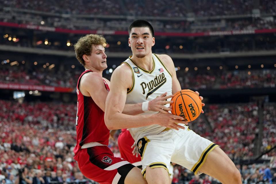 Apr 6, 2024; Glendale, AZ, USA; North Carolina State Wolfpack forward Ben Middlebrooks (34) knocks the ball away from Purdue Boilermakers center Zach Edey (15) during the second half in the semifinals of the men's Final Four of the 2024 NCAA Tournament at State Farm Stadium. Mandatory Credit: Bob Donnan-USA TODAY Sports