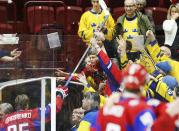 Russia's Mikhail Grigorenko hands his stick into the crowd after Russia defeated Canada following their IIHF World Junior Championship bronze medal ice hockey game in Malmo, Sweden, January 5, 2014. REUTERS/Alexander Demianchuk (SWEDEN - Tags: SPORT ICE HOCKEY)