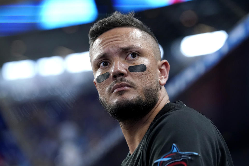 Miami Marlins shortstop Miguel Rojas looks from the dugout before a baseball game against the Philadelphia Phillies, Friday, July 15, 2022, in Miami. (AP Photo/Lynne Sladky)