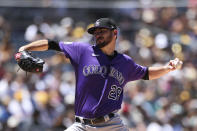 Colorado Rockies starting pitcher Austin Gomber winds up against the San Diego Padres in the first inning of a baseball game Sunday, Aug. 1, 2021, in San Diego. (AP Photo/Derrick Tuskan)