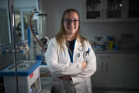 Frances Lees, an engineer for Afrigen Biologics and Vaccines, poses for a photo in Cape Town, South Africa on Tuesday, Oct. 19, 2021. A team of Afrigen scientists is assembling the equipment needed to reverse engineer Moderna's coronavirus vaccine. The scientists are effectively making an end run around an industry that has vastly prioritized rich countries over poor in both vaccine sales and manufacturing. (AP Photo/Jerome Delay)