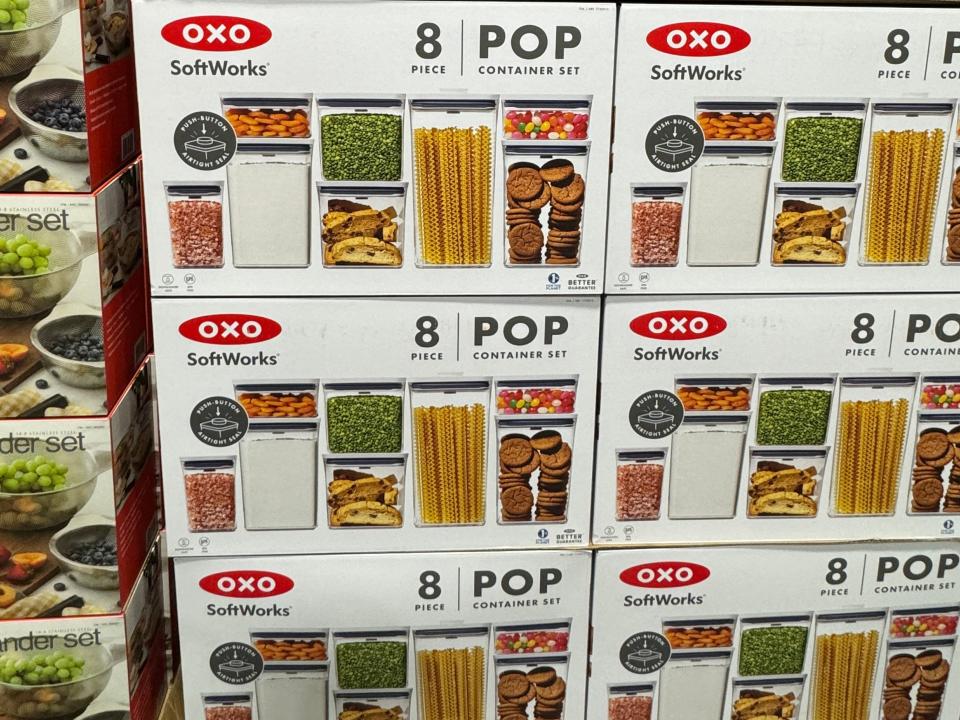 Oxo pop 8-piece storage containers stacked on display in boxes at Costco