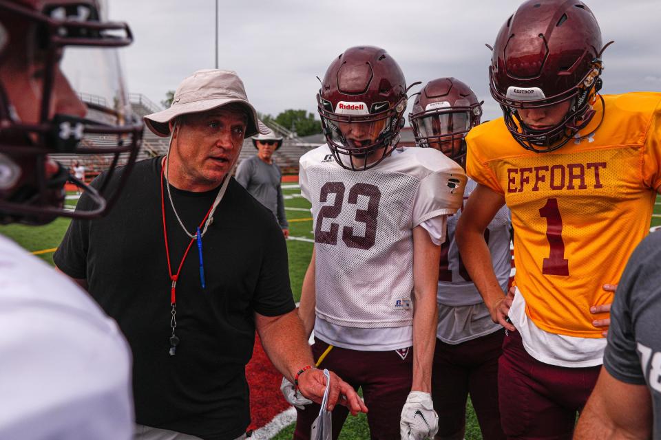 Bastrop offensive coordinator Aaron Cupp gives instructions to his players during 2022 spring football practice. In college, Cupp was a BYU running back who was a Cougars redshirt freshman the year that Steve Sarkisian arrived in Provo as a junior college quarterback. He still espouses Sarkisian's leadership abilities some 28 years later.