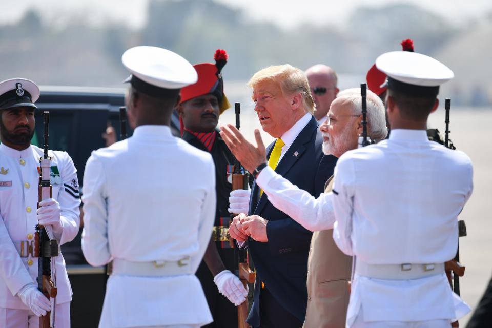 India's Prime Minister Narendra Modi (2R) greets US President Donald Trump upon his arrival at Sardar Vallabhbhai Patel International Airport in Ahmedabad on February 24, 2020. (Photo by Mandel NGAN / AFP) (Photo by MANDEL NGAN/AFP via Getty Images)