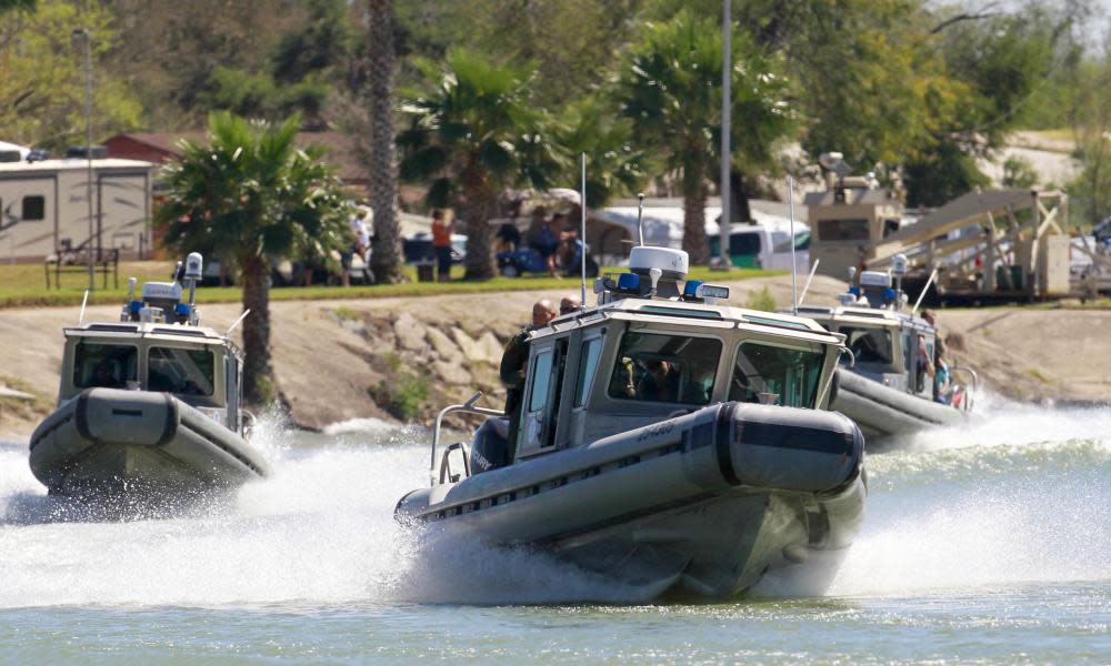 US Customs and Border Protection boats carrying the speaker of the House, Paul Ryan, and other legislators travel the Rio Grande in Texas on Wednesday.