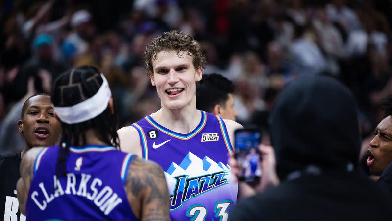 Utah Jazz forward Lauri Markkanen (23) celebrates with Utah Jazz guard Jordan Clarkson (00) after his game-winning free throw in overtime during an NBA game at Vivint Arena in Salt Lake City on Feb. 23, 2023.