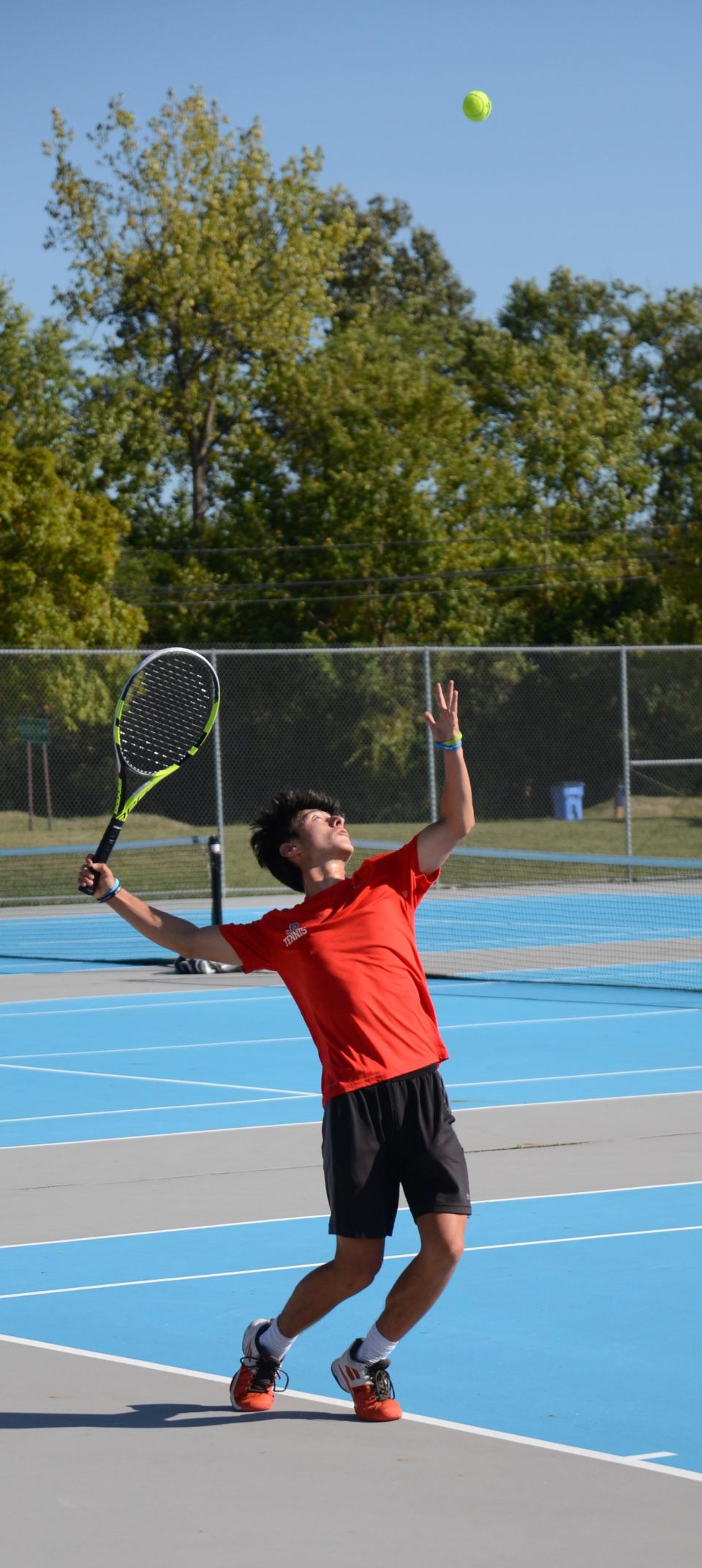 Bedford’s Noah Kaplan serves during a match earlier this season. He repeated as Regional champion at No. 1 singles Thursday.