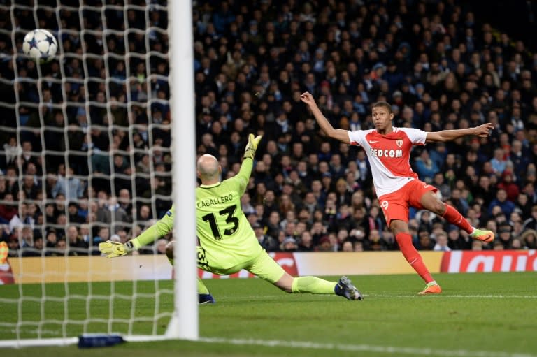 Monaco's Kylian Mbappe (R) scores a goal during their UEFA Champions League round of 16 1st leg match against Manchester City, at the Etihad Stadium in Manchester, on February 21, 2017