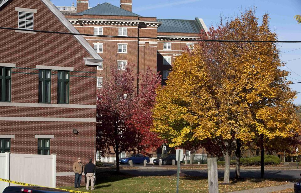 Law enforcement officers guard access to F. Don James Hall at Central Connecticut State University during a lockdown in New Britain, Connecticut November 4, 2013. A person has been taken into custody at Central Connecticut State University on Monday after officials locked down the campus when a suspicious person, possibly armed, was spotted, said New Britain Mayor Tim O'Brien. Citing students, local media said police had searched for a person who appeared to be carrying a gun and what looked like a sword. (REUTERS/Michelle McLoughlin)