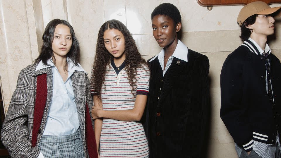 Models pose backstage during the Fall-Winter 2024 Tommy Hilfiger show. "It's Tommy’s Americana come to life," a press release from the brand said, "in shades of red, white, and blue that infuse the brand’s iconic DNA with modernity." - Corey Tenold/Tommy Hilfiger