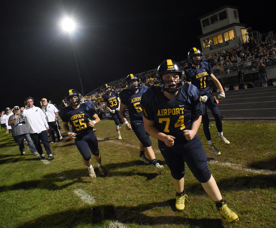 Chay Wickenheiser of Airport yells out after scoring against Detroit East English during a 70-18 Airport rout in a Division 4 playoff game on Friday, October 27, 2023.