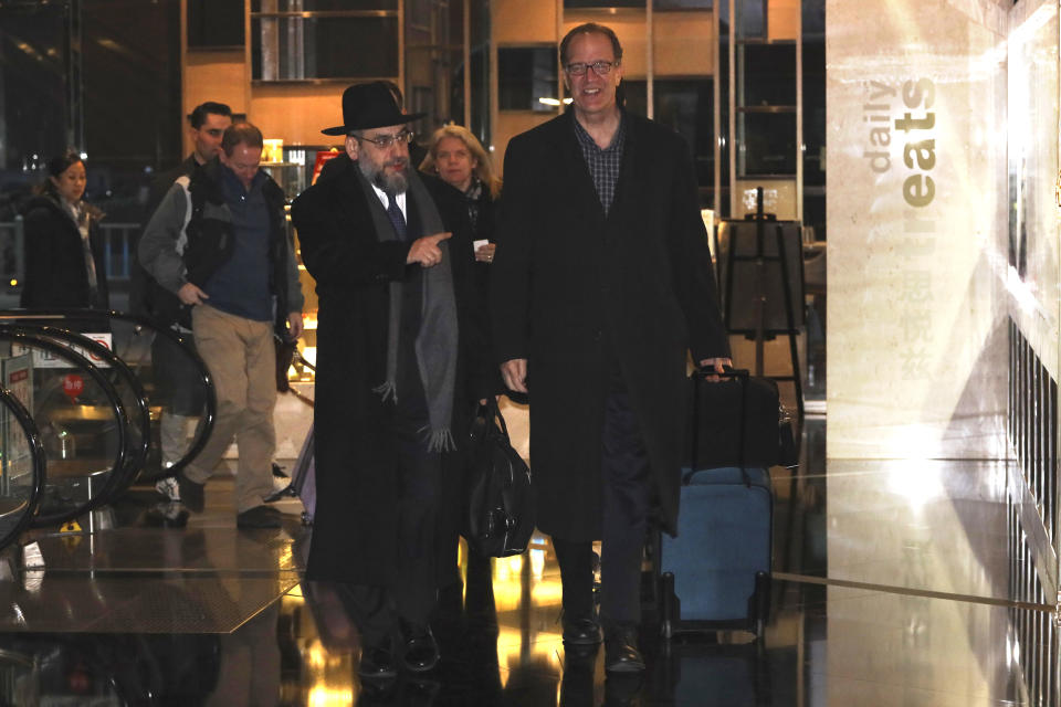 U.S. Undersecretary for International Affairs David Malpass, right, arrives as part of a trade delegation at a hotel in Beijing, China, Sunday, Jan. 6, 2019. A U.S. delegation led by deputy U.S. trade representative, Jeffrey D. Gerrish arrived in the Chinese capital ahead of trade talks with China,(AP Photo/Ng Han Guan)