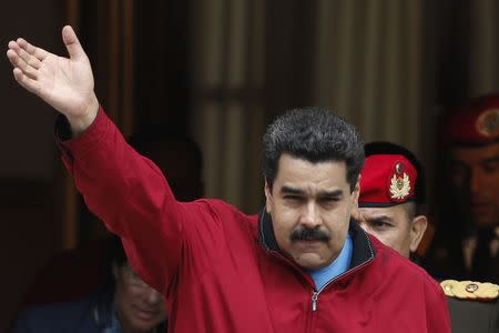 Venezuela's President Nicolas Maduro greets supporters after arriving back at Miraflores Palace in Caracas January 17, 2015. REUTERS/Jorge Silva