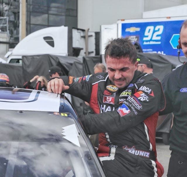 Frankie Muniz climbs out of the car after making some laps early during ARCA Menards Series practice on Friday afternoon.