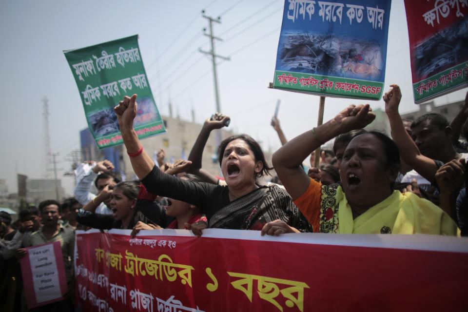 Relatives of victims killed in the collapse of Rana Plaza and activists shout slogans on the first year anniversary of the accident, as they gather in Savar April 24, 2014. Protesters and family members of victims demand compensation on the one year anniversary of the collapse of Rana Plaza, in which more than 1,100 factory workers were killed and 2,500 others were injured.