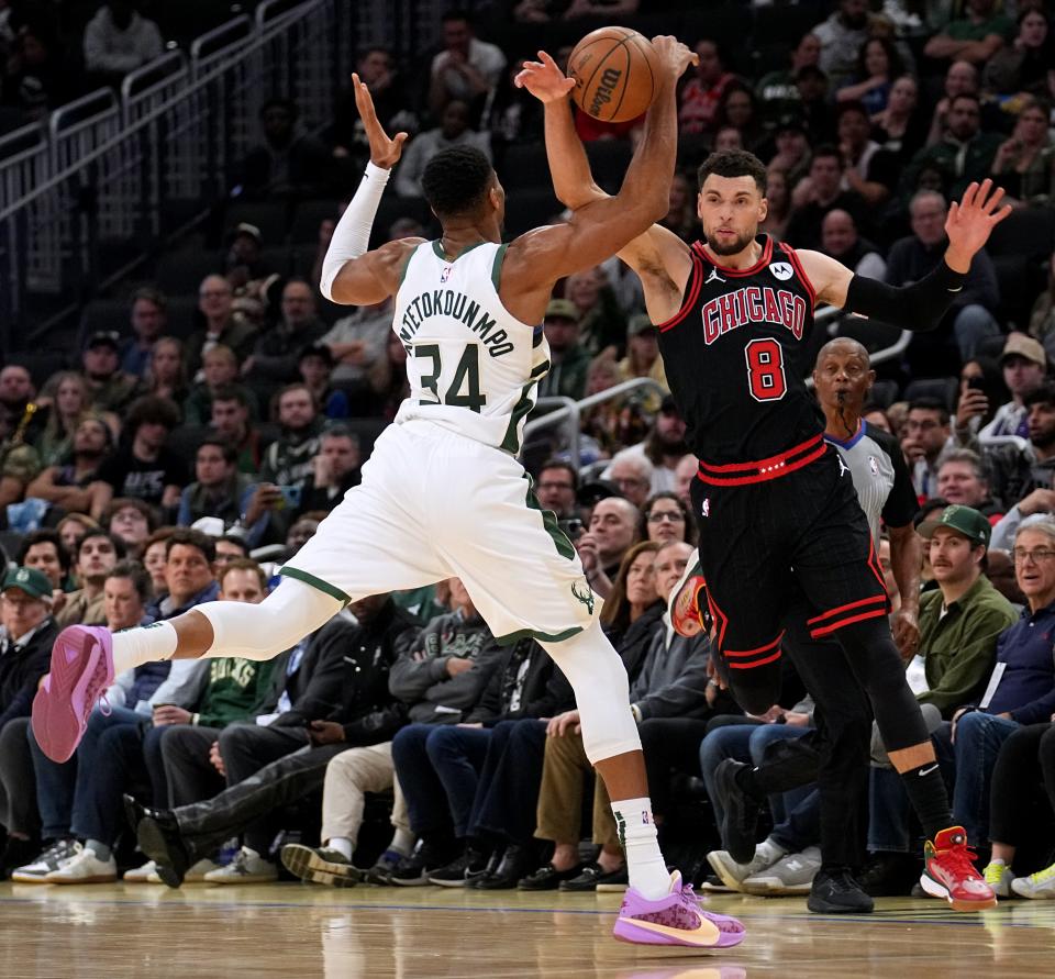 Milwaukee Bucks forward Giannis Antetokounmpo (34) steals the ball from guard Zach LaVine (8) during the second half of their game Monday, November 13, 2023 at Fiserv Forum in Milwaukee, Wisconsin. The Milwaukee Bucks beat the Chicago Bulls 118-109.