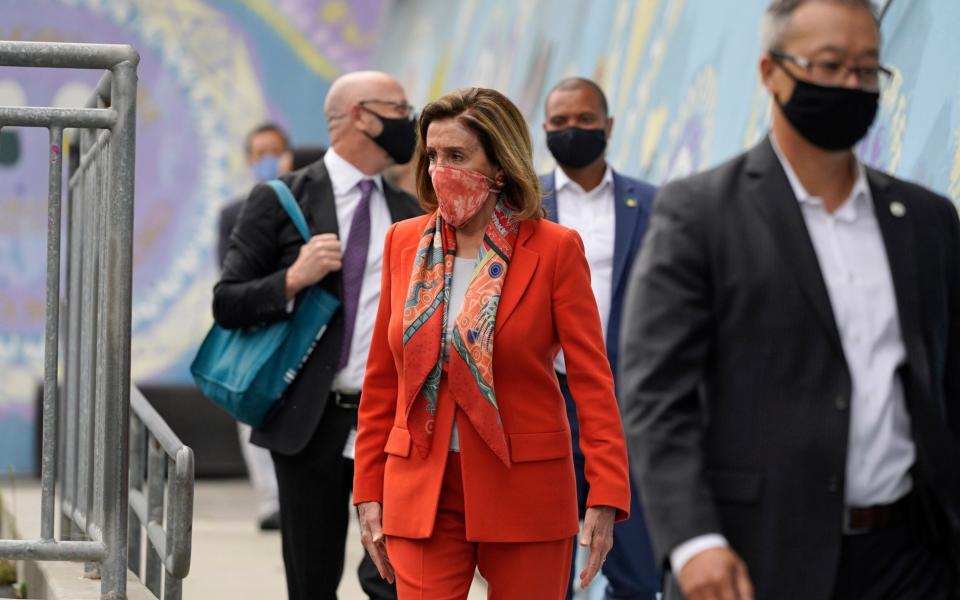 Nancy Pelosi, who visited a school in San Francisco on Wednesday, insists she has done nothing wrong - AP