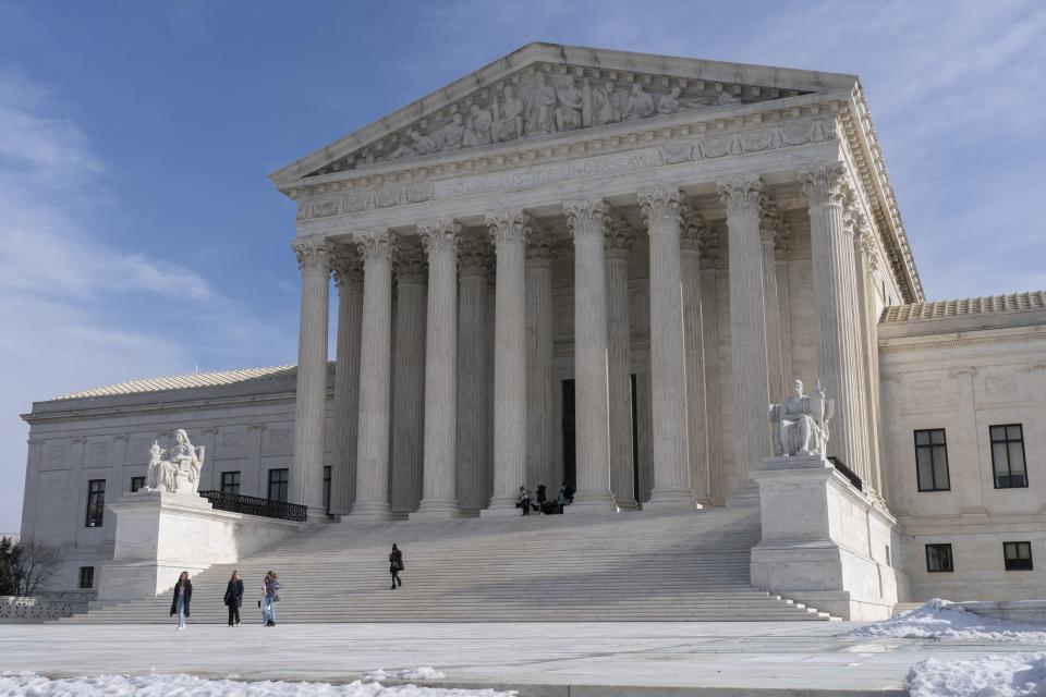 Tourists visit the Supreme Court, Wednesday, Jan., 2022, in Washington, as the court heard arguments in the case, 'Federal Election Commission v. Ted Cruz for Senate,' about post-election contributions. (AP Photo/Jacquelyn Martin)