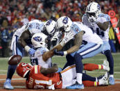 <p>Tennessee Titans wide receiver Eric Decker (87) is congratulated by tight end Delanie Walker (82), wide receiver Rishard Matthews (18), and wide receiver Corey Davis (84) on his 22-yard touchdown catch against Kansas City Chiefs defensive back Eric Murray (21), during the second half of an NFL wild-card playoff football game, in Kansas City, Mo., Saturday, Jan. 6, 2018. (AP Photo/Charlie Riedel) </p>