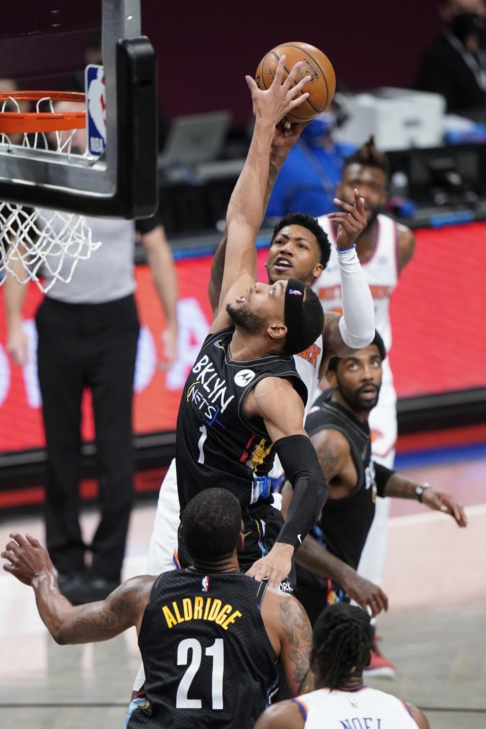 Brooklyn Nets' Bruce Brown (1) blocks a shot by New York Knicks' Elfrid Payton during the second half of an NBA basketball game Monday, April 5, 2021, in New York. (AP Photo/Frank Franklin II)