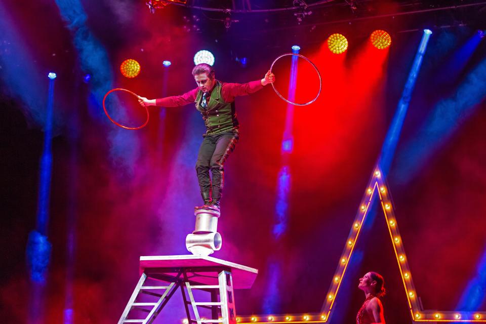 An acrobat performs in a scene from A Magical Cirque Christmas