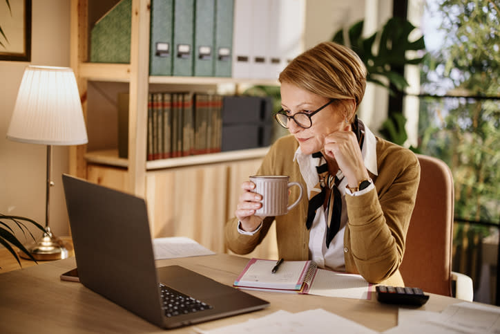 A woman researching which documents she needs to file LLC taxes.