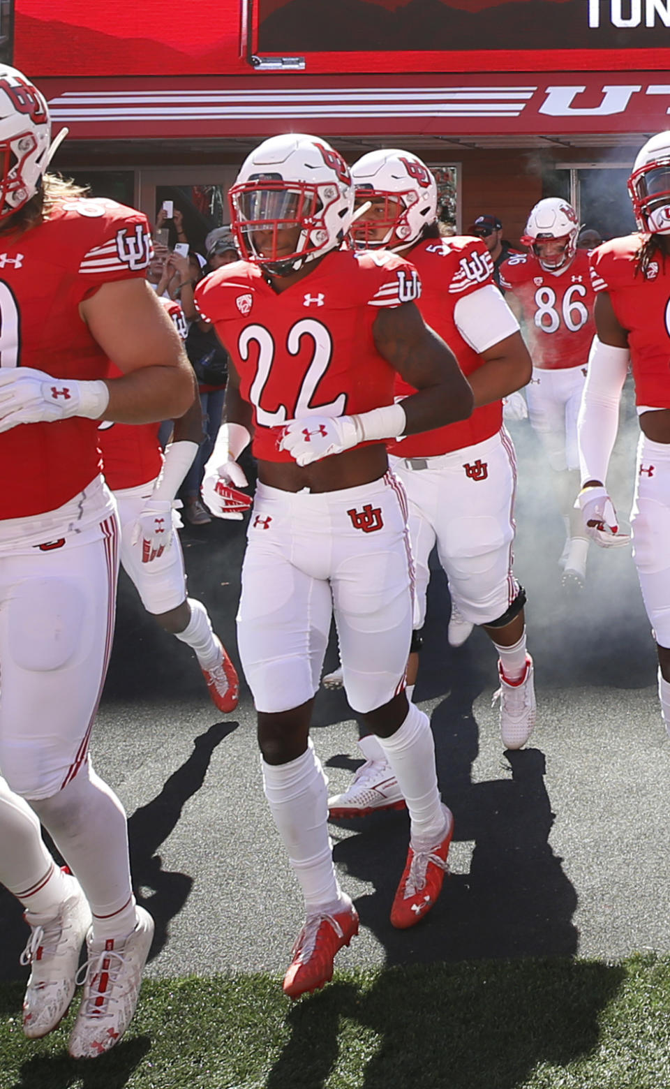 Utah cornerback Aaron Lowe (22) runs onto the field before an NCAA college football game against Washington State on Saturday, Sept. 25, 2021, in Salt Lake City, Utah. A University of Utah football player has been killed in a shooting at a house party early Sunday, Sept. 26, 2021, Salt Lake City police said. The shooting that killed Aaron Lowe occurred just after midnight, only hours after the Utes beat Washington State 24-13. Police said another victim in the attack was in critical condition and authorities were searching for a suspect. (AP Photo/George Frey)