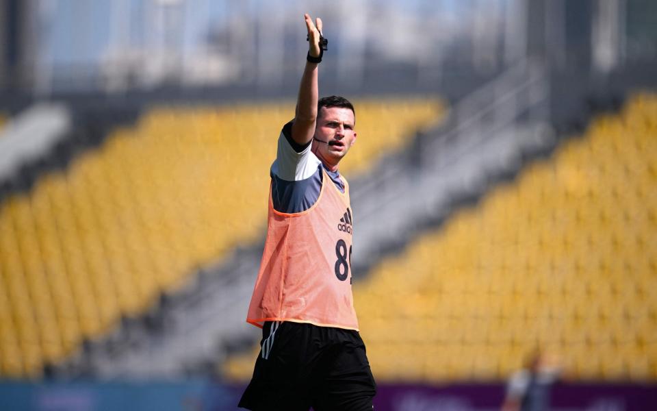 Michael Oliver is one of two Premier League referees at the tournament - AFP via Getty Images/Anne-Christine Poujoulat