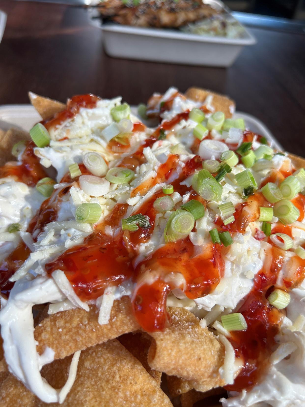 Crab Rangoon Nachos is one of the dishes being served out of an Asian street food-inspired food truck at 4th Street Fillin Station in Cocoa Beach.