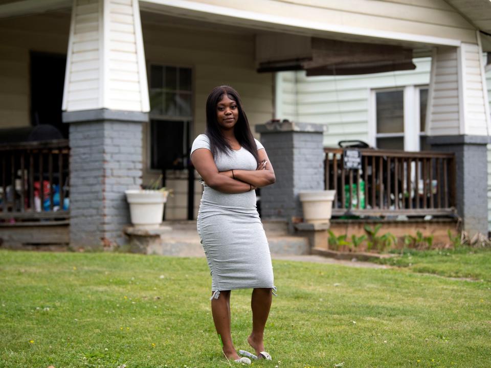 College student Trinity Clark stands on the lawn of a home where she was arrested in August 2021. Every charge against her was dropped by a judge who called the case "disturbing."