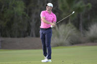 Rory McIlroy, of England, watches his shot from the 18th fairway during the third round of the Workday Championship golf tournament, Feb. 27, 2021, in Bradenton, Fla. (AP Photo/Phelan M. Ebenhack)