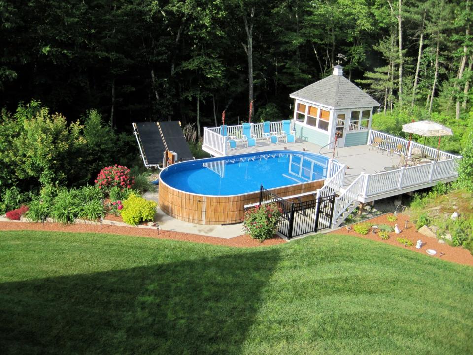 Overhead shot of an above ground pool with an attached pool house