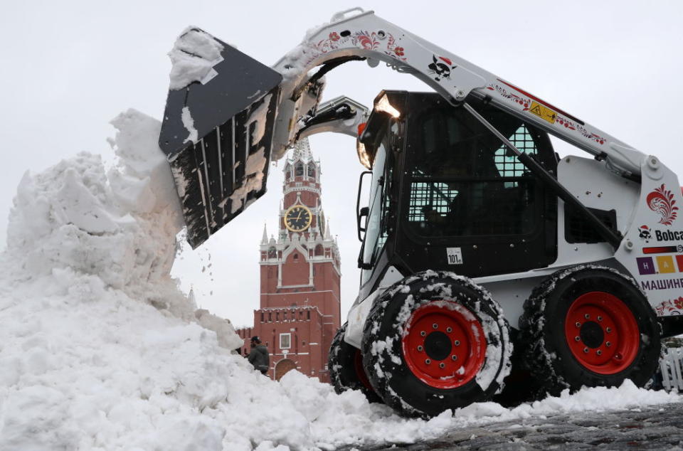 A skid steer loader clears snow in Red Square after a heavy snowstorm. 