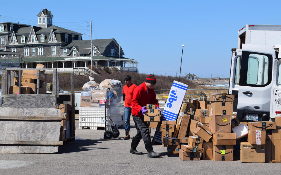 A package delivery service on the island loads deliveries from companies like Amazon on March 26. (Photo: Kari Curtis for HuffPost)