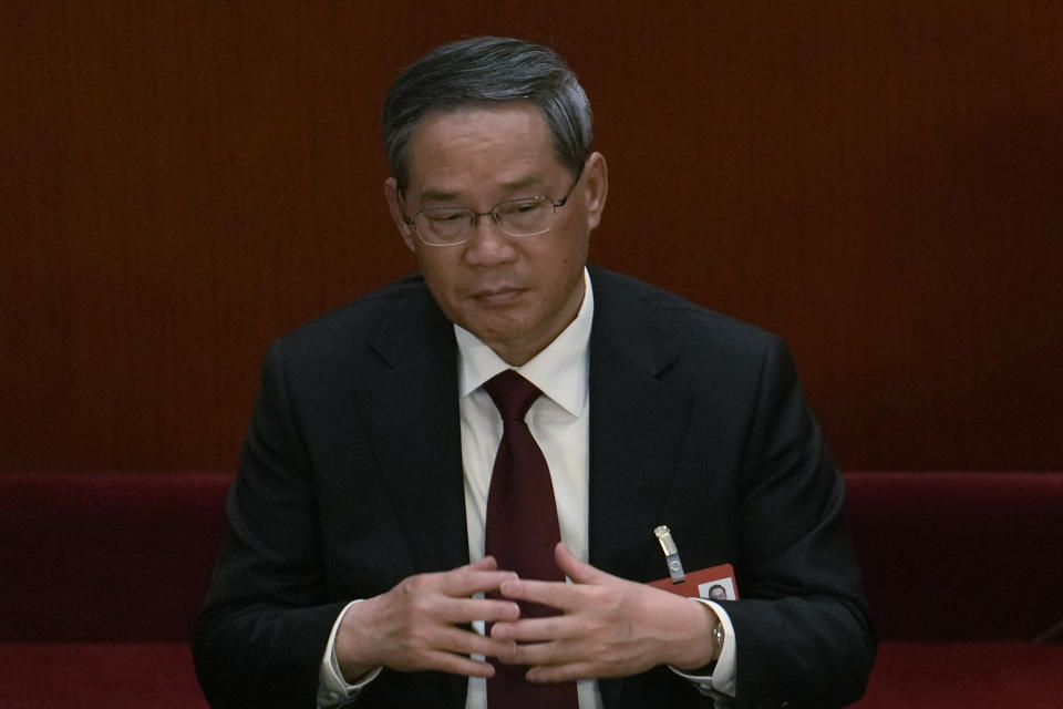 Politburo Standing Committee member Li Qiang attends a session of China's National People's Congress (NPC) at the Great Hall of the People in Beijing, Tuesday, March 7, 2023. The pro-business track record of the man poised to become China's top economic official on Saturday will make Li Qiang's term a test of whether he might moderate President Xi Jinping's tendency to intervene. (AP Photo/Ng Han Guan)