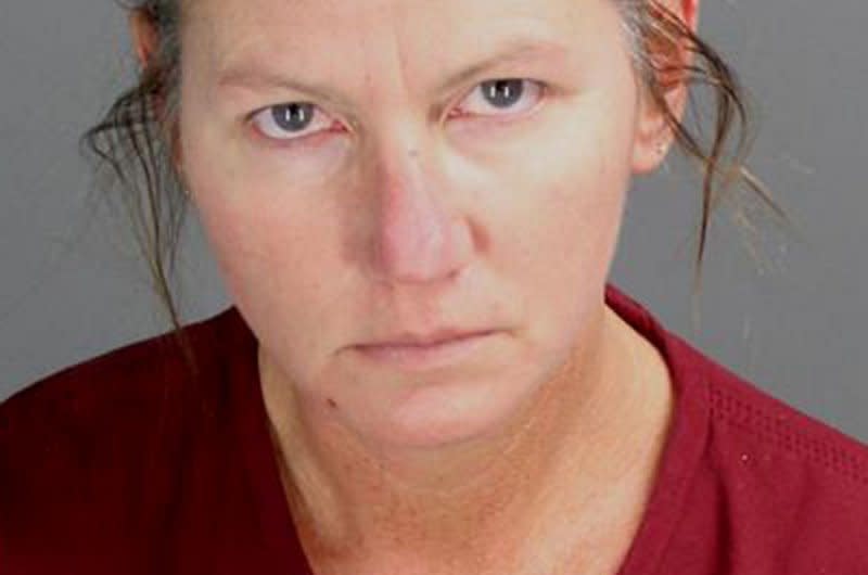 Jennifer Lynn Crumbley, the mother of Ethan Crumbley, is pictured in her booking photo as released by the Oakland County Sheriff's Office on December 4, 2021. At her manslaughter trial Tuesday, her employer testified that she returned to work the day of the shooting after meeting with school counselors over "disturbing" images Ethan had drawn. Photo courtesy of Oakland County Sheriff's Office/UPI