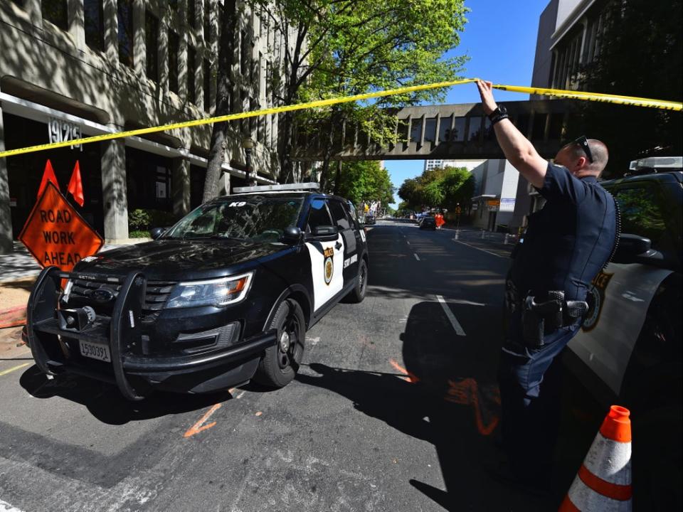 Sacramento Police at the scene of the shooting on Sunday (AP)