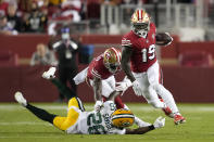 San Francisco 49ers wide receiver Deebo Samuel (19) runs past Green Bay Packers free safety Darnell Savage (26) during the second half of an NFL football game in Santa Clara, Calif., Sunday, Sept. 26, 2021. (AP Photo/Tony Avelar)