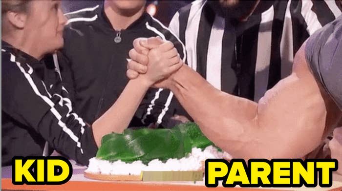 A woman labeled "kid" and a man with a huge bicep, labeled "parent," arm wrestling