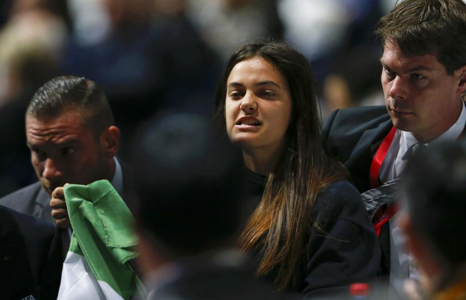 Security officers block a pro-Palestine protestor at the 65th FIFA Congress in Zurich