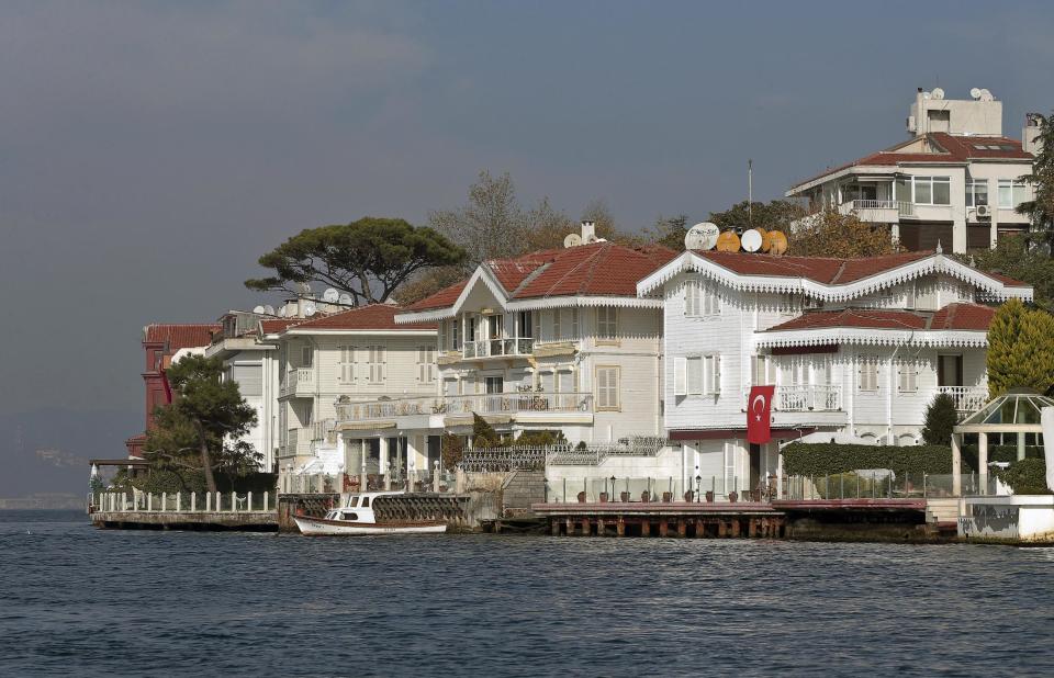 FILE - This Oct. 28, 2013 file photo shows waterside mansions called "yali," in Istanbul, Turkey. Istanbul is best-known among tourists for mosques and bazaars but the city offers many other interesting things for visitors to see, including the classic wooden-framed yali mansions along the waterfront. (AP Photo, File)