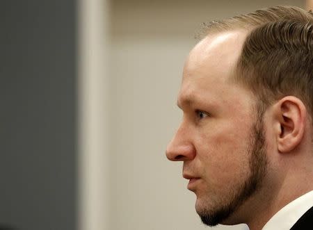 Norwegian mass killer Anders Behring Breivik reacts as he returns after a break to the court room, in Oslo Courthouse August 24, 2012. REUTERS/Stoyan Nenov
