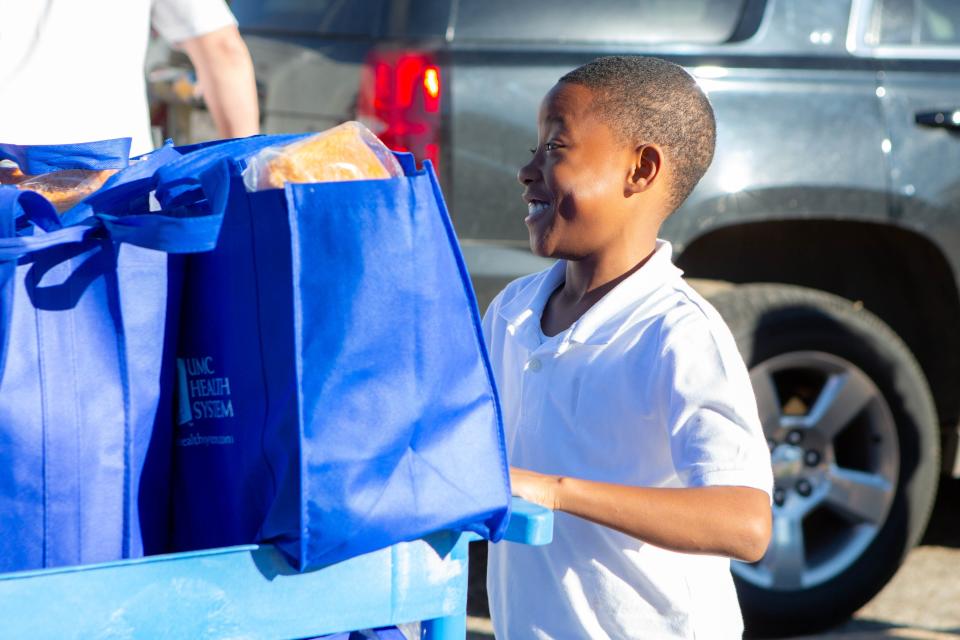 UMC delivers food bags to Brown Elementary School on Wednesday, December 20, 2023, in Lubbock.