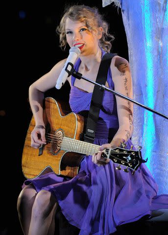 <p>Larry Busacca/Getty</p> Taylor Swift on the Speak Now tour