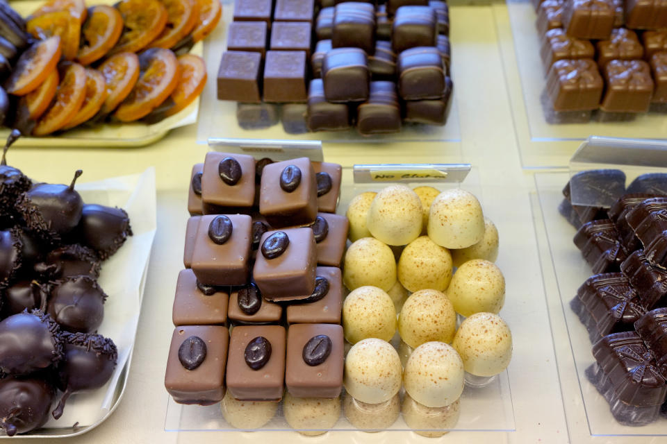 Luxury handmade Belgian Chocolates are seen displayed at Sandrine a chocolate shop owned by Niaz Mardan, in south west London, Thursday, March 21, 2024. Niaz Mardan, is suffering due to high cocoa prices, she's making no profits and fears she will have to close the shop that's been around for 25 years (she's the third owner and took over in 2019). (AP Photo/Kirsty Wigglesworth)