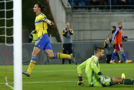 Sweden's Zlatan Ibrahimovic (L) scores a goal against Liechtenstein's goalkeeper Peter Jehle during their Euro 2016 group G qualification soccer match in the Rheinpark stadium in Vaduz, Liechtenstein October 9, 2015. REUTERS/Ruben Sprich