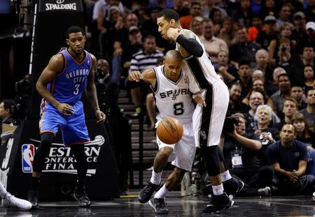 May 21, 2014; San Antonio, TX, USA; San Antonio Spurs guard Patrick Mills (8) brings the ball up court against the Oklahoma City Thunder in game two of the Western Conference Finals of the 2014 NBA Playoffs at AT&T Center. Soobum Im-USA TODAY Sports