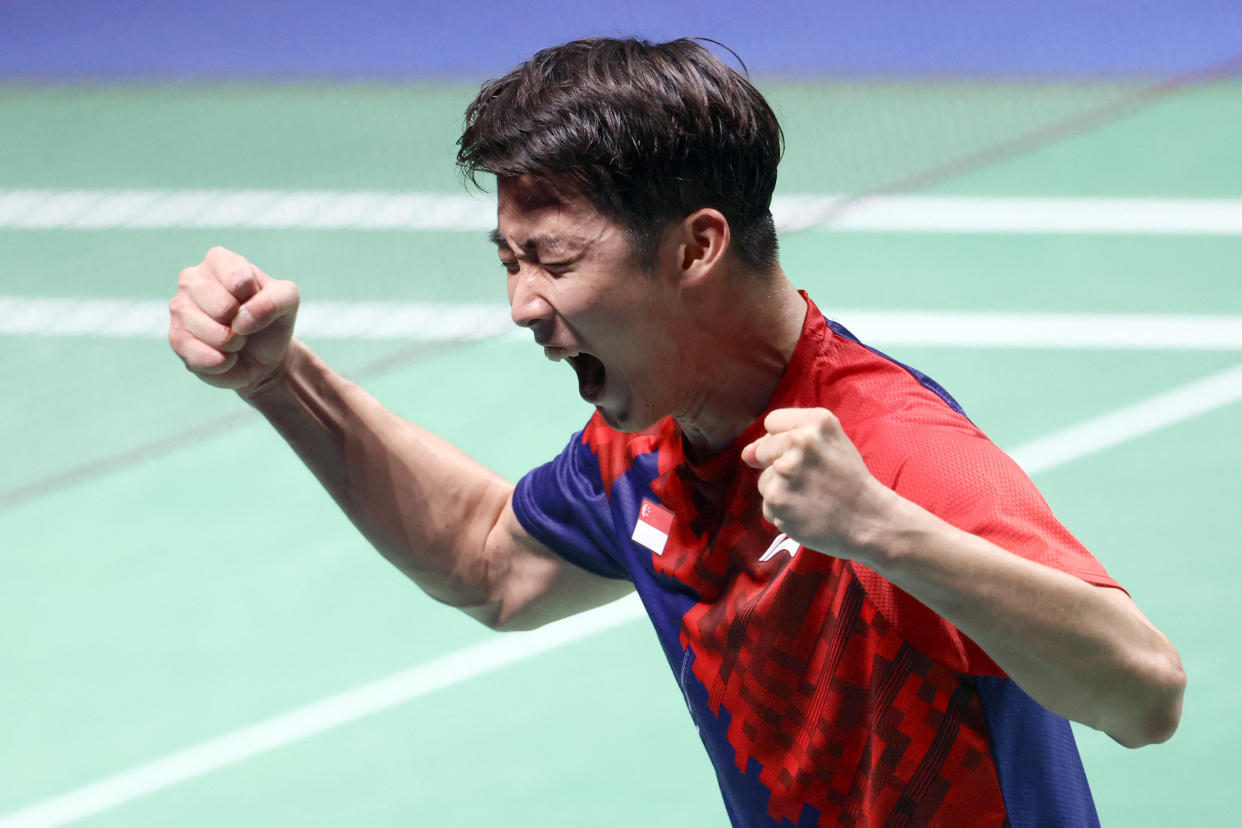 Singapore's Loh Kean Yew celebrates beating India's Srikanth Kidambi during the men's singles final of the BWF World Championships in Huelva.