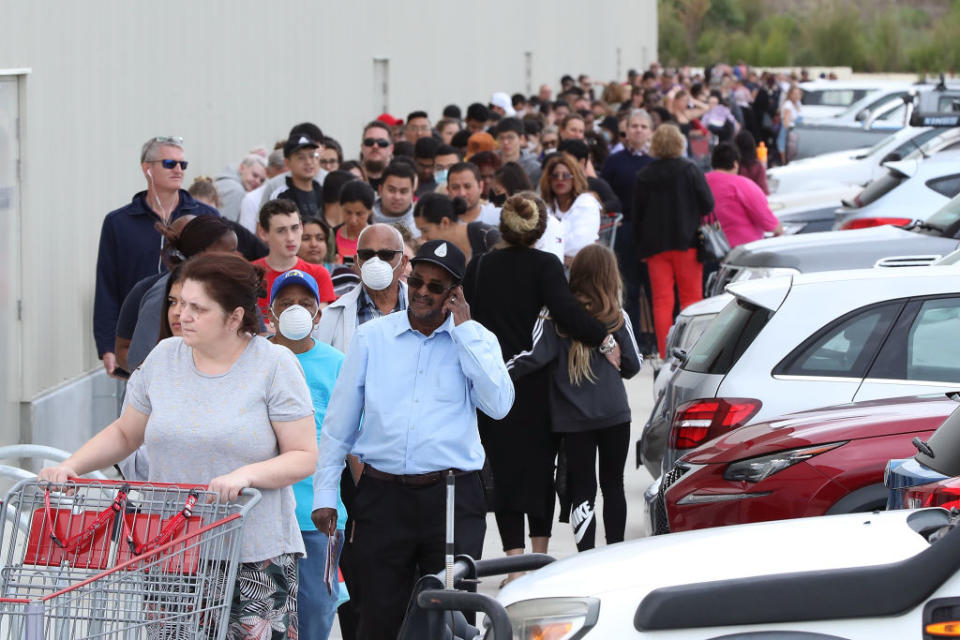 PERTH, AUSTRALIA - MARCH 19: Shoppers line up around the building waiting to enter at Costco Perth on March 19, 2020 in Perth, Australia. (Photo by Paul Kane/Getty Images)